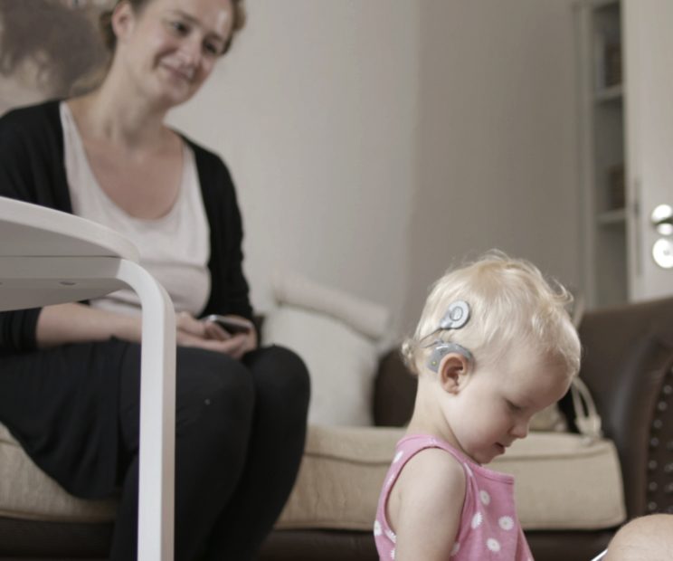 baby with cochlear implant