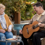 man and woman playing guitar
